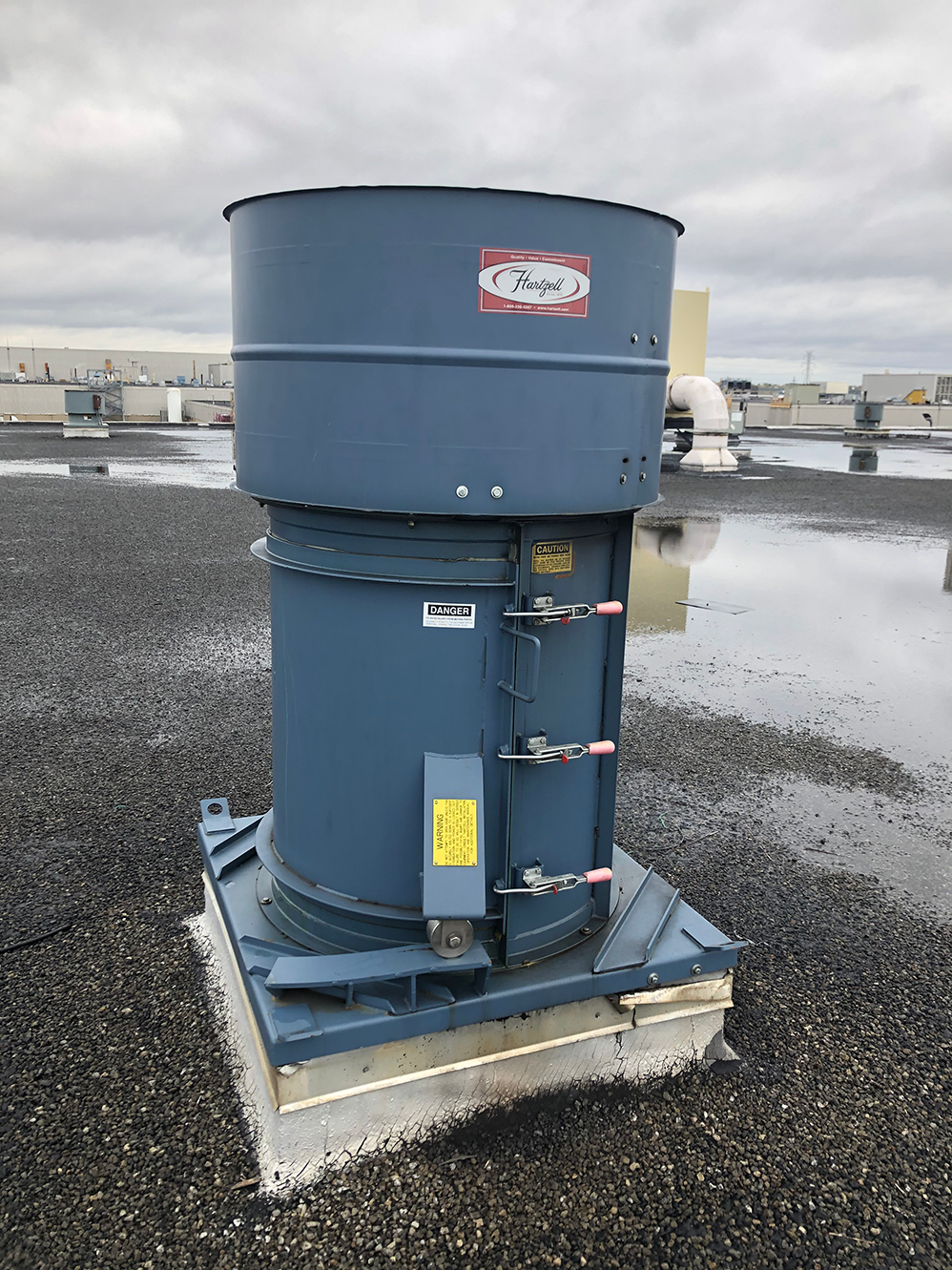 Swing out roof exhauster